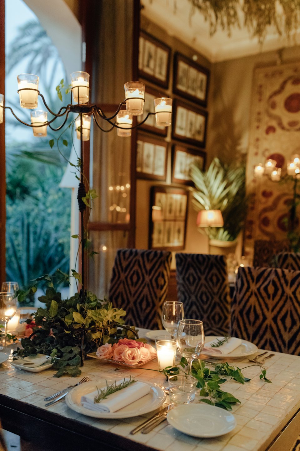 Elegant dining table set with flowers and candles for a special occasion.